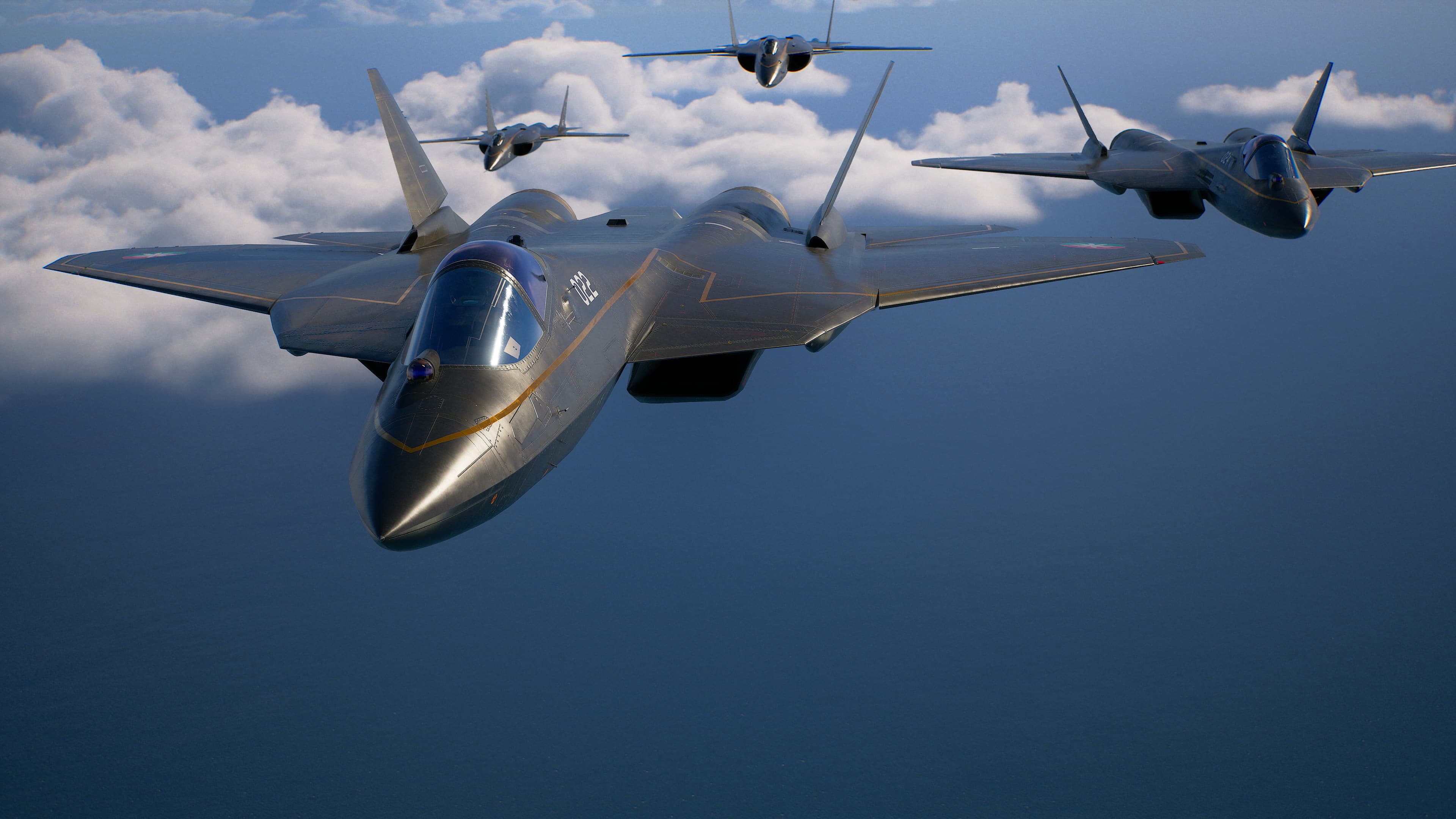 Quatro caças voam em formação sobre nuvens em screenshot oficial de Ace Combat 8: Wings of Theve, agora em acesso antecipado.